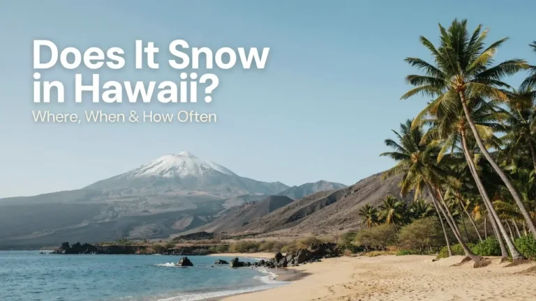 Snow-covered Mauna Kea summit in Hawaii above a warm tropical coastline
